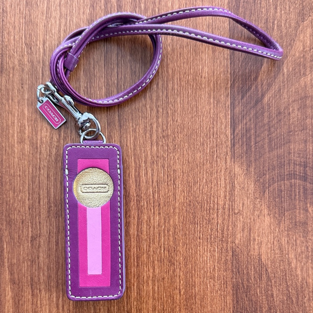 Vintage Coach iPod shuffle case with hangtag and strap.